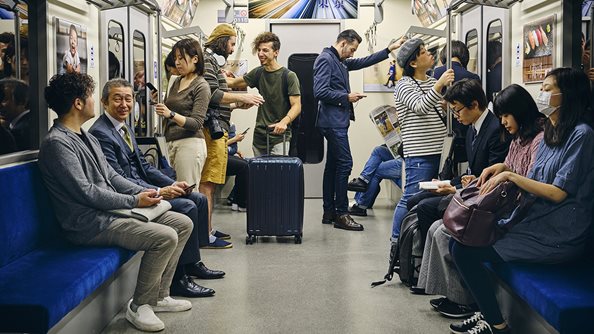 Train passengers with cell phones